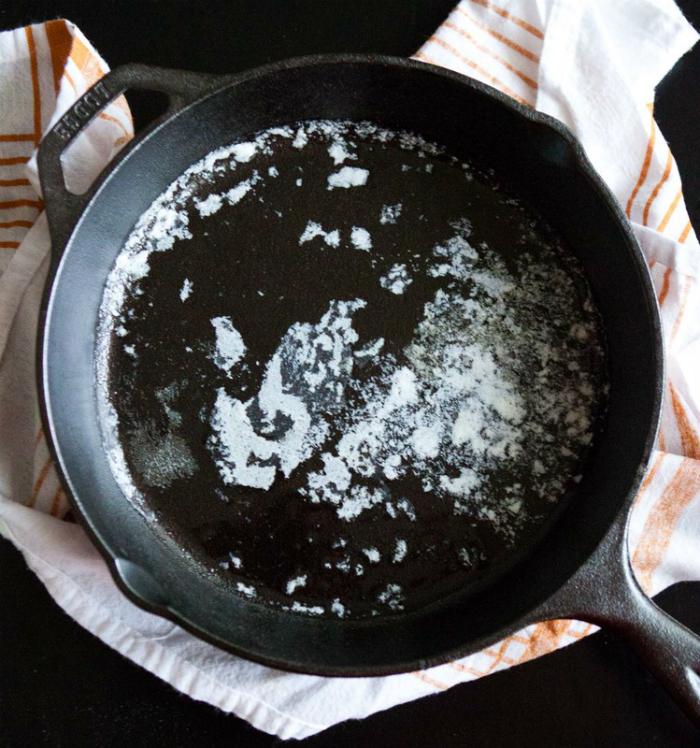 Salt will dissolve the stuck grease in the pan for easy cleaning