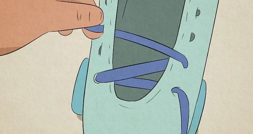 Luồn dây bên trái qua lỗ thứ 2 bên phải