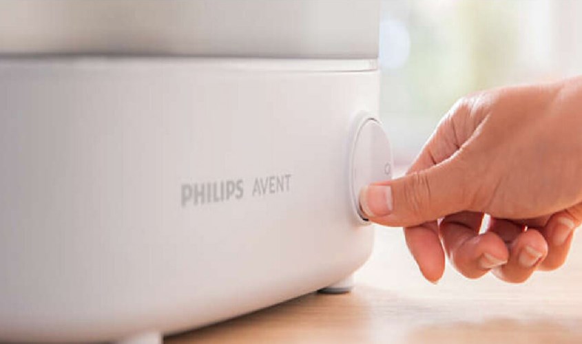 Sau khi đậy nắp và cắm nguồn điện thì bật công tắc để máy hoạt động