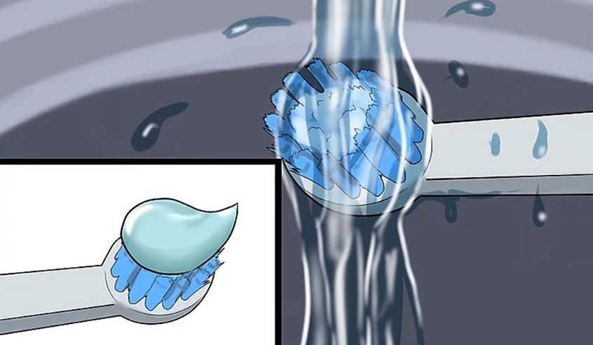 Làm ướt bàn chải đánh răng và cho lượng kem đánh răng bằng cỡ hạt đậu lên bàn chải Làm ướt bàn chải đánh răng và cho lượng kem đánh răng bằng cỡ hạt đậu lên bàn chải