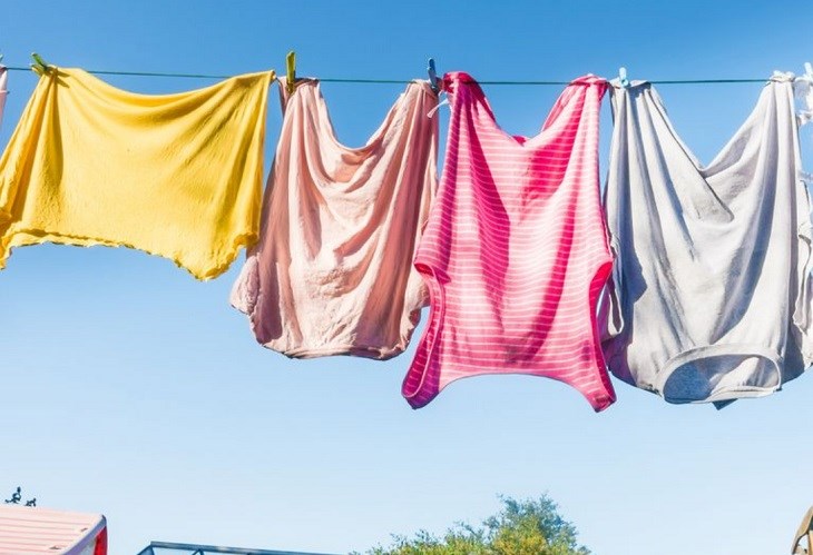 Prioritize drying clothes in the morning to allow for more sunlight and reduce odors