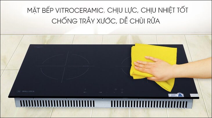 Mặt bếp từ đôi lắp âm Malloca MH-7320I bằng kính Vitroceramic sáng bóng, chịu nhiệt tốt, hạn chế trầy xước, tiện làm sạch