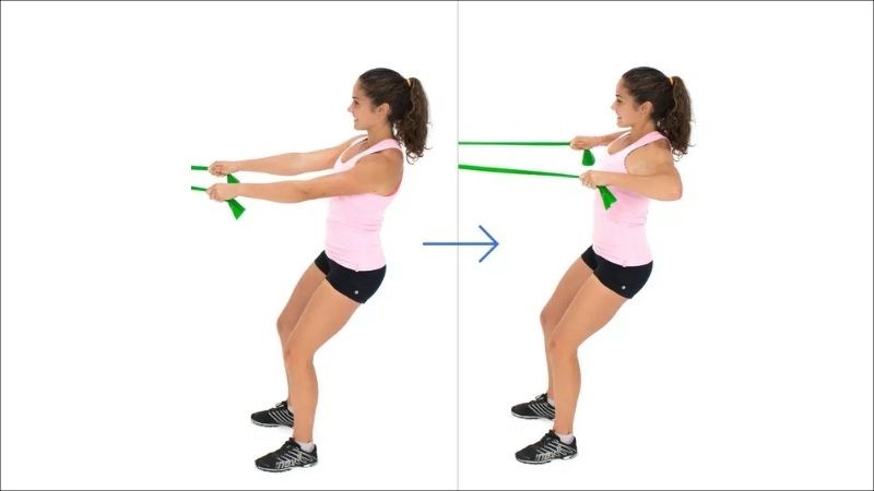 Đứng với dây kháng lực giúp tăng cường sức mạnh và giảm đau lưng