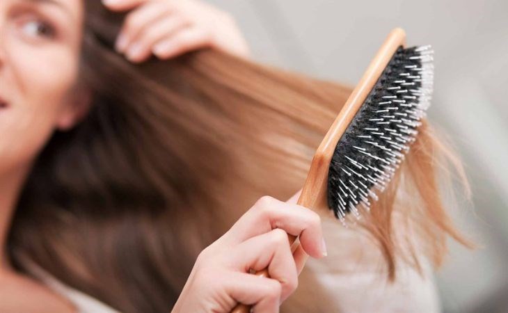 A round comb with sparse teeth helps smooth and reduce hair loss