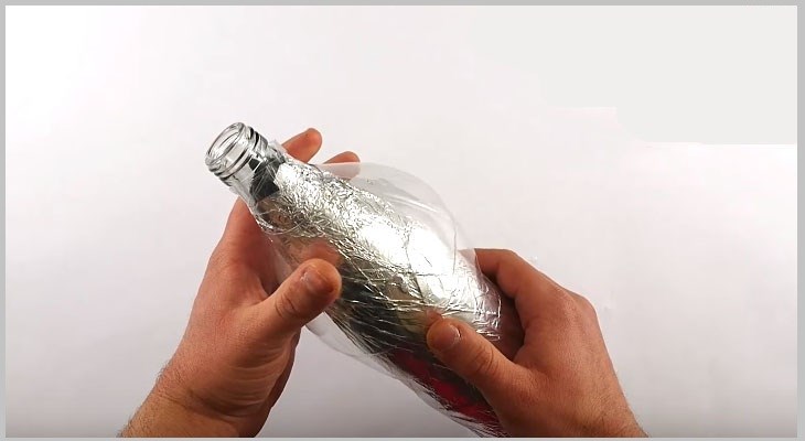 Securing the top of the bottle shell