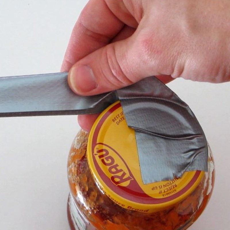 Attach a small piece of duct tape to 3/4 of the bottle cap corner and twist gently.