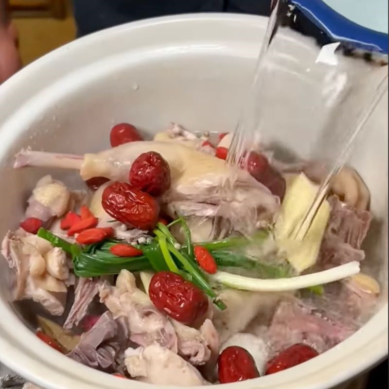 Bước 2 Chần sơ gà Canh sầu riêng hầm gà