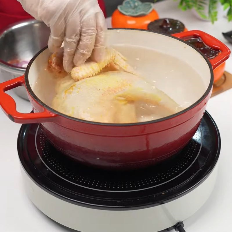 Bước 1 Sơ chế và luộc gà Bún gà măng mọc