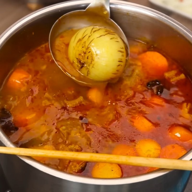 Bước 5 Thêm cà rốt và nước dừa Cách nấu bò kho truyền thống