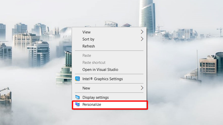 Nhấn phải chuột vào màn hình, sau đó click chuột chọn mục Personalize