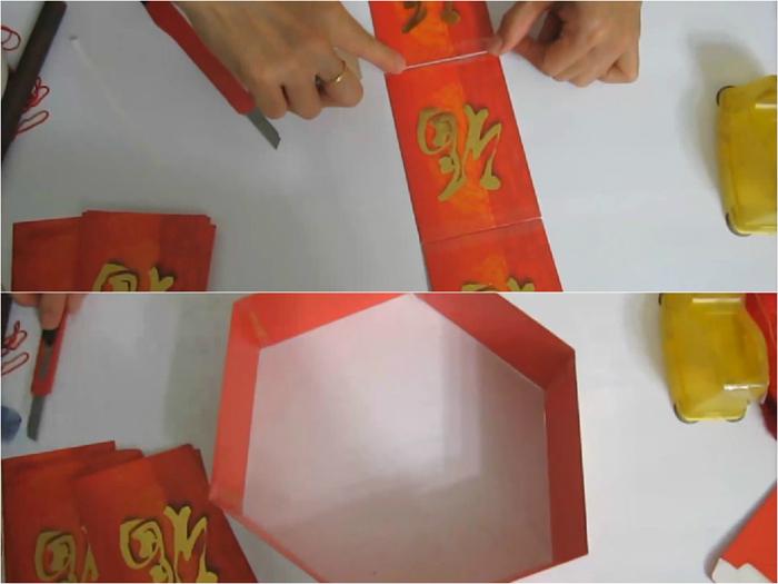 Tape 6 lucky money envelopes together to create a hexagon shape