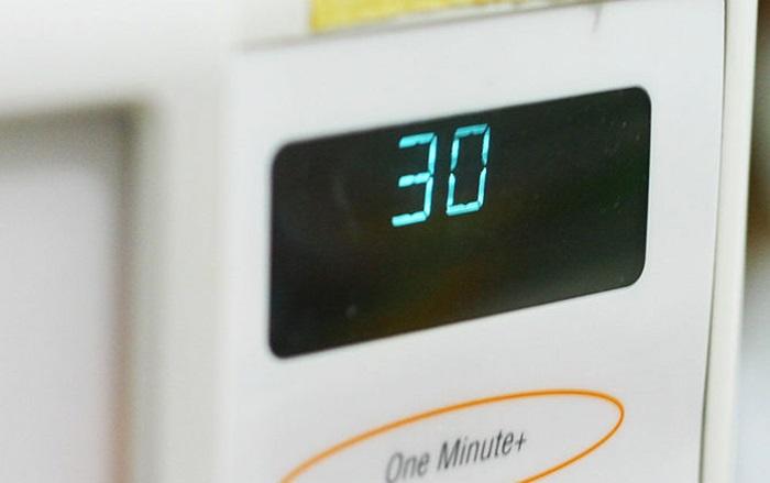 Put the dish and the cup of water back into the microwave, turn on the microwave and set the timer to 30 seconds.