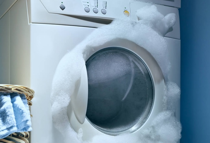 Using too much detergent causes the foam to overflow out of the drum