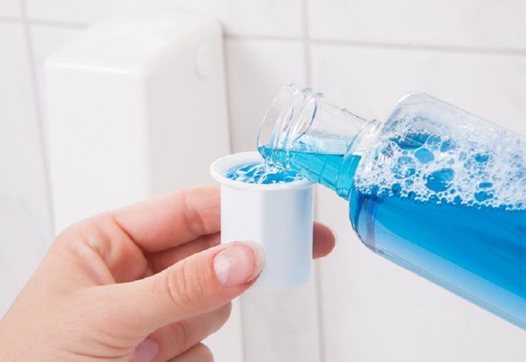 Remove grease stains with mouthwash