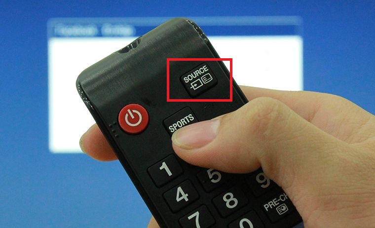 Nhấn nút SOURE hoặc INPUT,hoặc biểu tượng có hình mũi tên trên remote