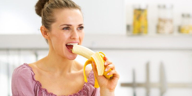 girl eating banana