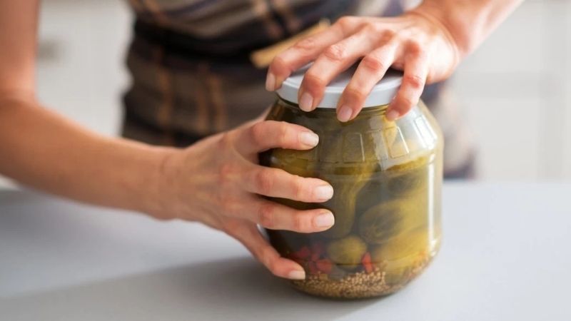 Open glass jar lid by asking someone stronger