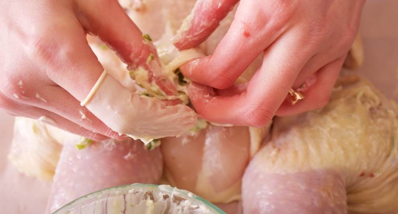 Insert butter between the layer of skin and chicken meat, brushing butter on top of the skin will make the roasted chicken more delicious