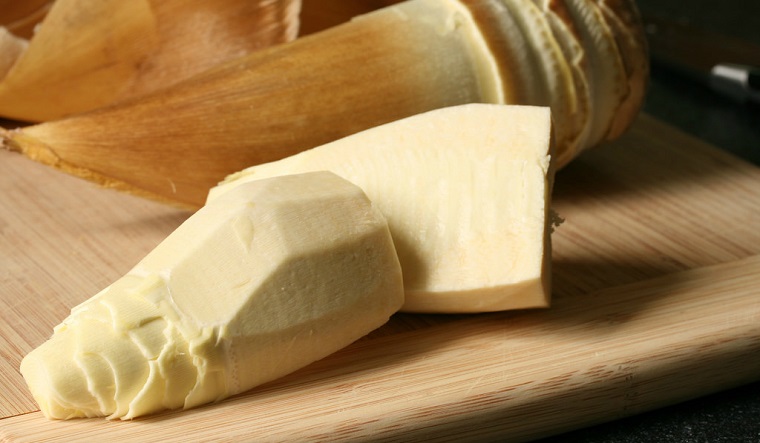 Peel off the sheaths of bamboo shoots before boiling