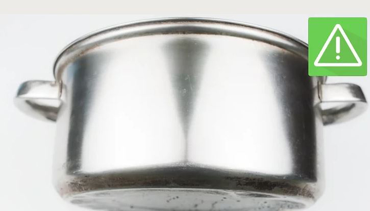 Find a well-ventilated space to clean the pan with metal cleaner