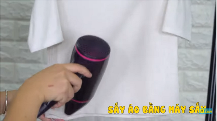 Use a hairdryer to straighten clothes