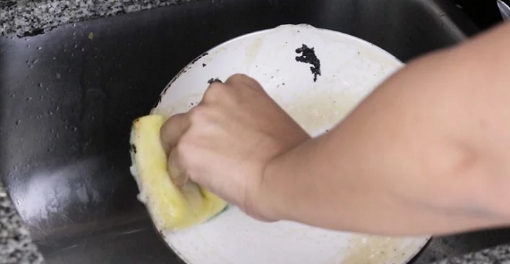 Wash the pan with a soft sponge