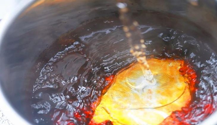 Pouring hot water into the pot