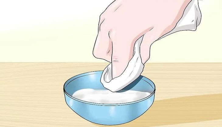 Dip the cloth into the baking soda mixture