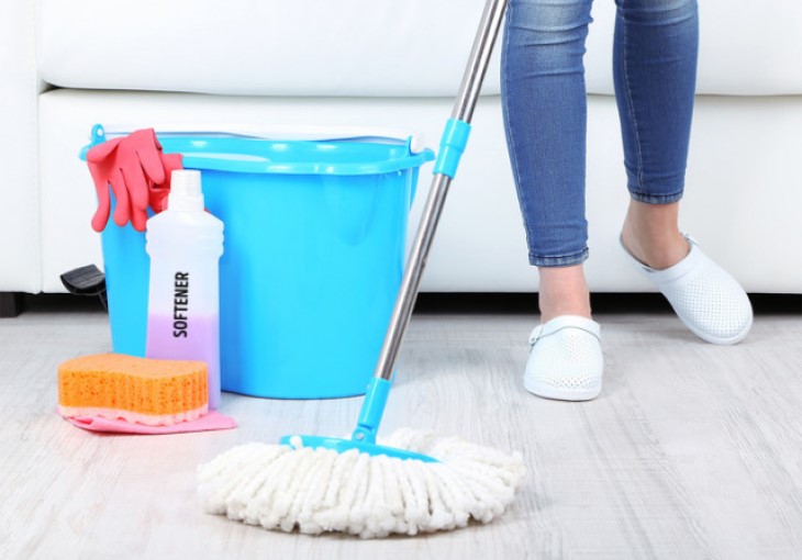 Mopping the floor and combining with essential oils to kill bacteria