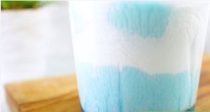 Pour the disinfectant solution onto the paper towel