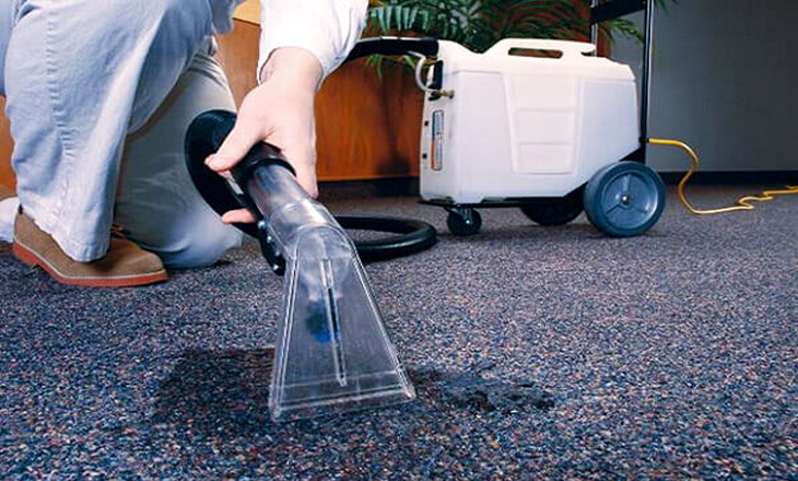 Using specialized cleaning equipment to wash carpets