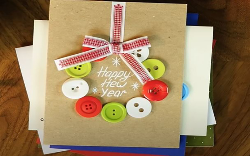 Decorating the card with buttons