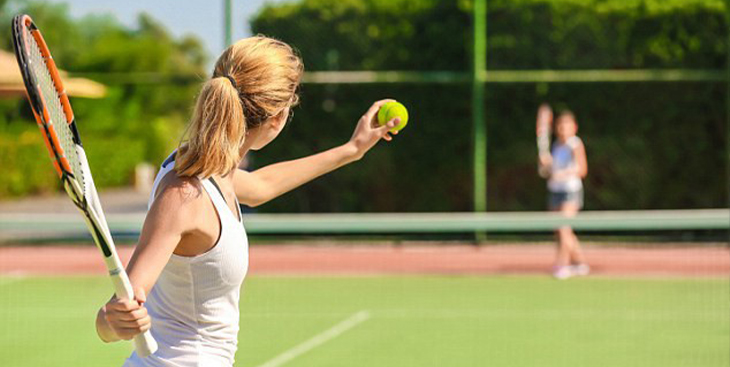 Playing tennis