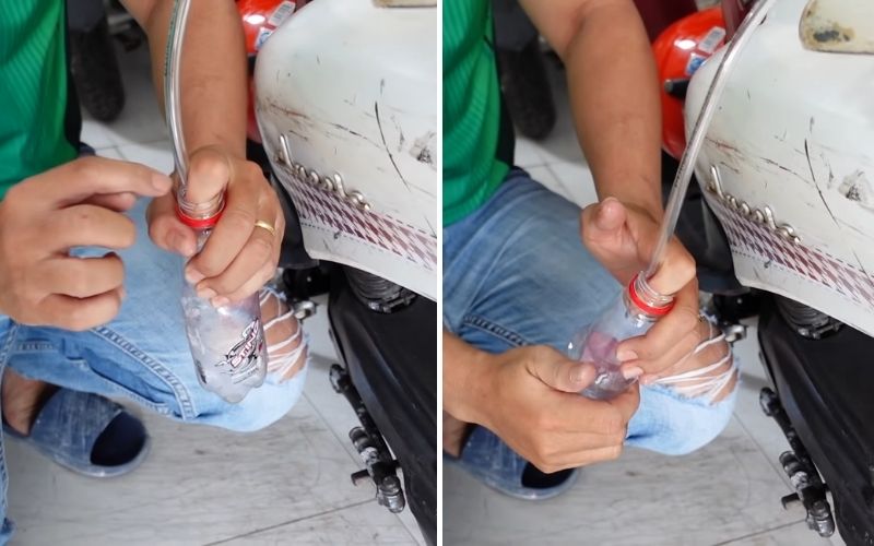 Bước 2: Tiếp đó, bạn dùng một tay bị kín miệng chai cũng như giữ chặt ống nhựa, không để không khí lọt qua, tay còn lại bóp thân chai vài lần cho đến khi xăng xuống, chảy vào chai nhựa.
