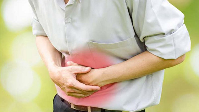 A Man with Stomach Ache from Consuming Too Much Rice Vinegar