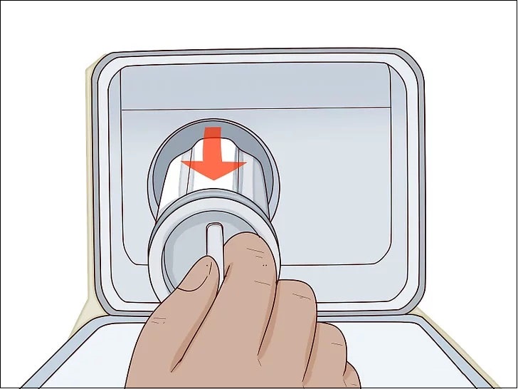 Bạn tháo nút xả màu trắng khỏi ống thoát nước khẩn cấp để nước còn sót lại trong lồng giặt chảy ra ngoài.