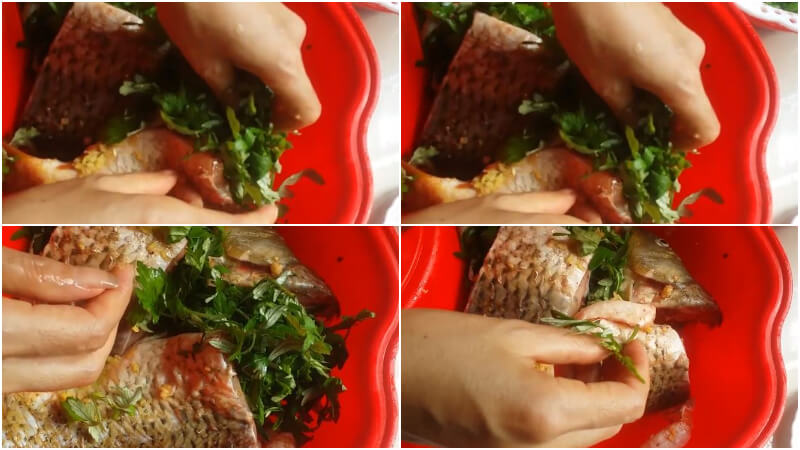 Sau đó nhét ít rau ngải cứu vào bụng cá, đầu cá, đuôi cá