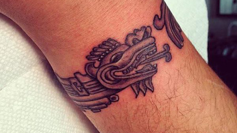 Dragon bracelet tattoo represents strength and vigor for men