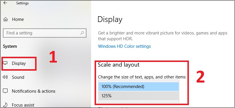 Bước 2: Chọn Display từ trường điều hướng bên trái. Sau đó, bạn cuộn xuống phần Scale and layout và điều chỉnh độ phân giải Display