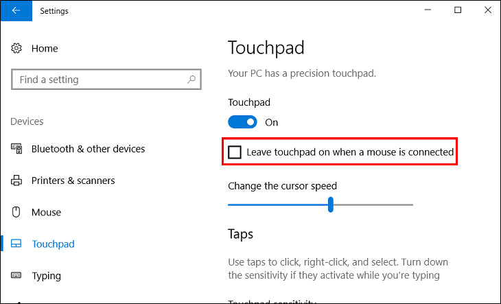 Tick bỏ chọn mục Leave touchpad on when a mouse is connected.