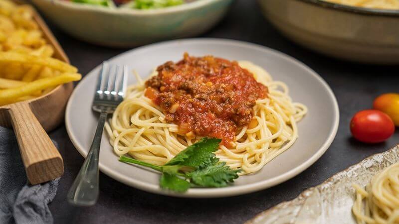 Spaghetti with tomato and ground beef sauce is a famous dish from Italy