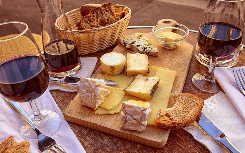 Enjoying French cheese with red or white wine