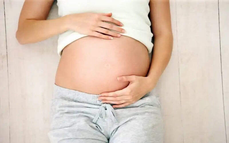 Tử cung phát triển và dịch âm đạo tiết ra nhiều khi thai vào tuần 13