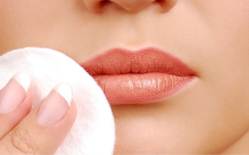 Apply a cotton pad soaked in warm water to your lips