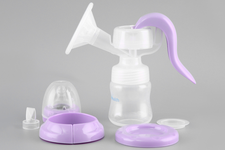 Image of manual breast pump parts being cleaned