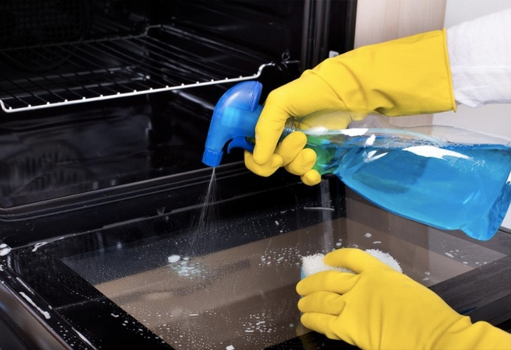 Use specialized solution to clean the oven