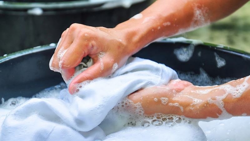 Frequently washing clothes with hot water