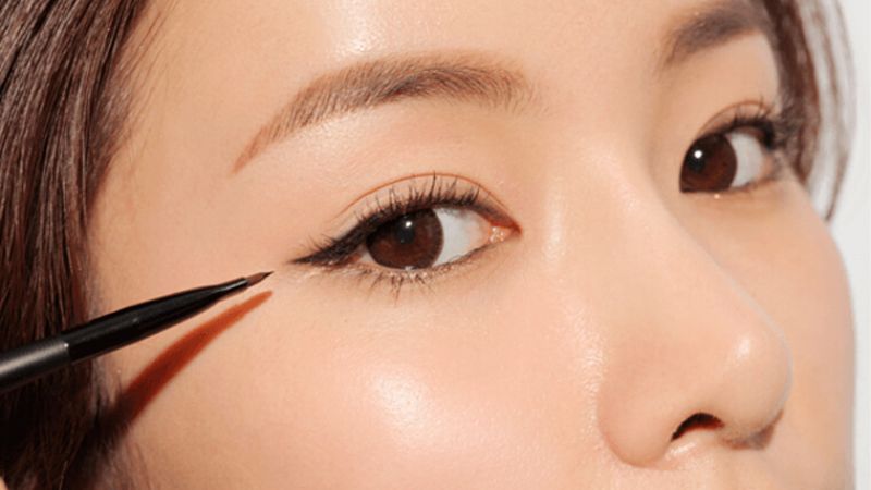 Line along the lash line and gently flick the tip at the outer corner of the eye for a more impressive look