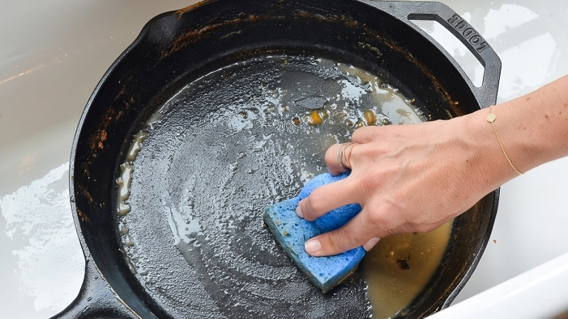 Washing cast iron pans with dishwashing liquid can damage the cast iron surface, leading to loss of non-stick coating and rust