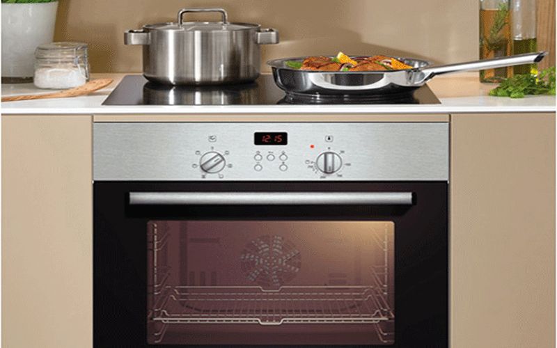 Placing a microwave under an induction cooker